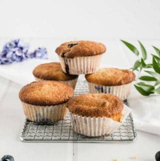 These Blueberry Muffins with natural yogurt are unbeatable: fluffy, tender, sweet juicy blueberries and a dash of lemony spark.