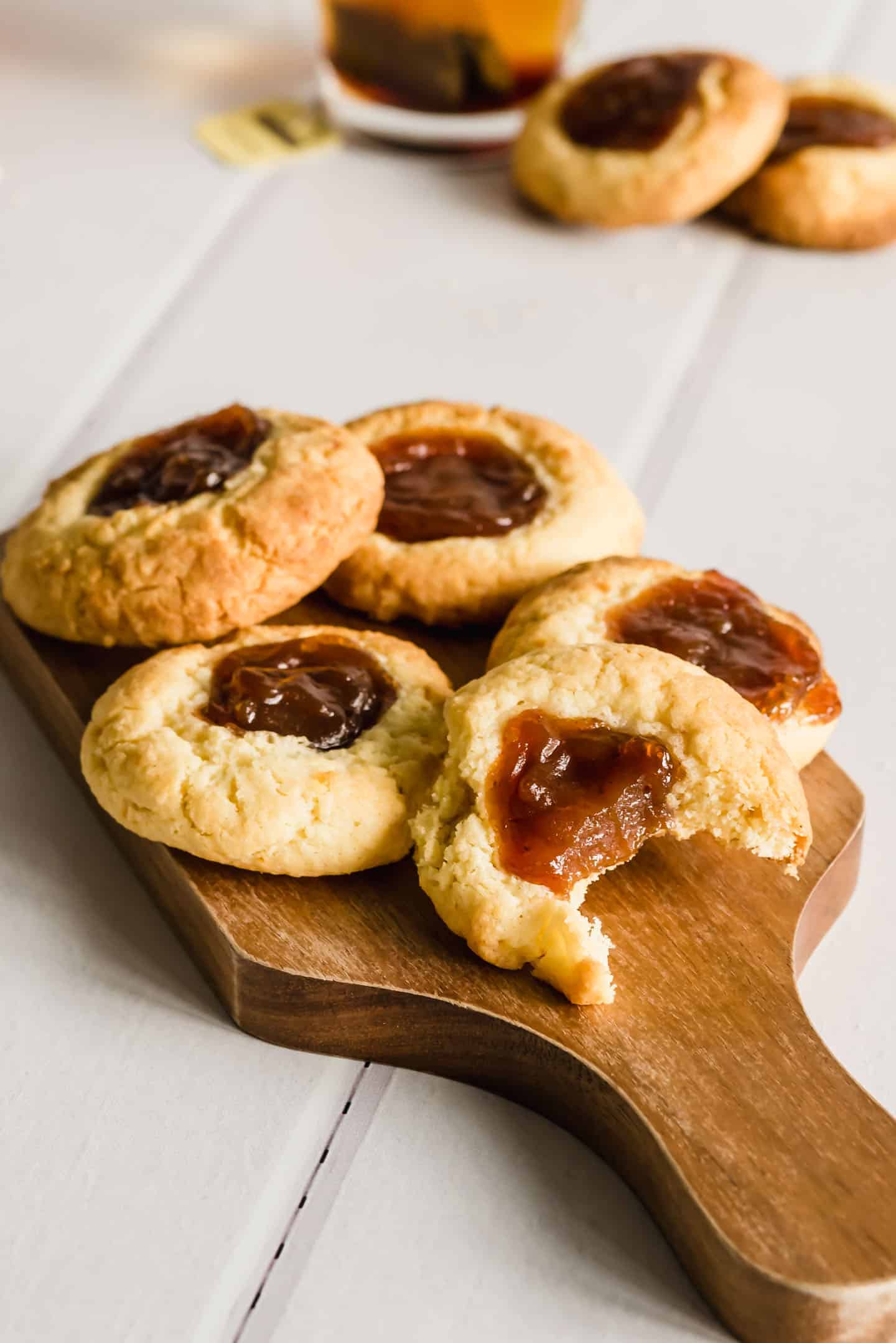 Quince Thumbprint Cookies on a wooden board