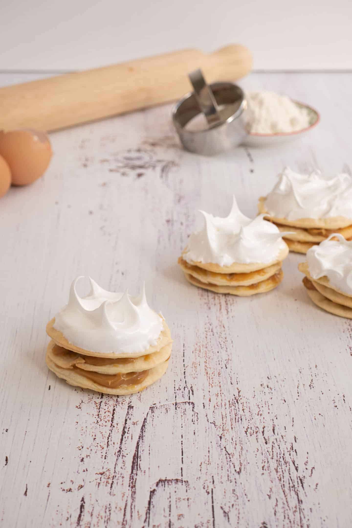 Mini Rogel sandwiches with dulce de leche and Swiss meringue