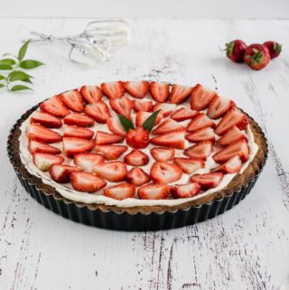 Traditional Strawberry and Cream Tart. Simple as buttery shortbread crust, smooth creamy filling and fresh strawberry topping.