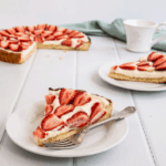 Traditional Strawberry and Cream Tart. Simple as buttery shortbread crust, smooth creamy filling and fresh strawberry topping.